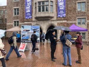 Stand.earth and SIZ hold a mock recruitment event at U of Washington to speak to students about Amazon's shipping pollution.