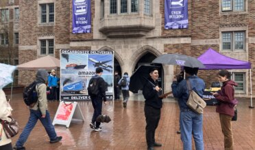 Stand.earth and SIZ hold a mock recruitment event at U of Washington to speak to students about Amazon's shipping pollution.